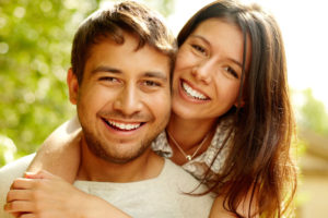 Dental Patients Smiling With Well Cared For Dental Implants In Bronx, NY