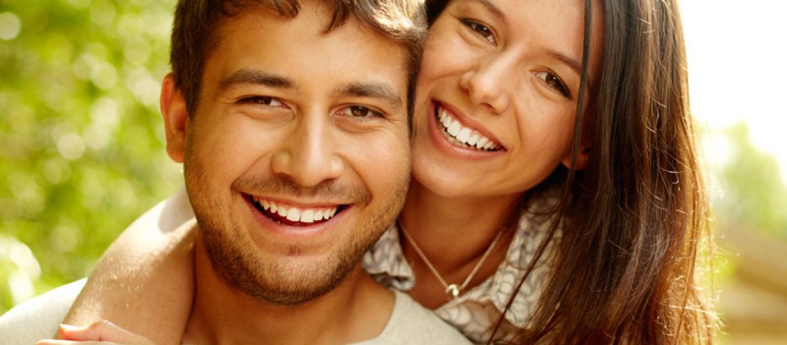 Dental Patients Smiling With Well Cared For Dental Implants In Bronx, NY
