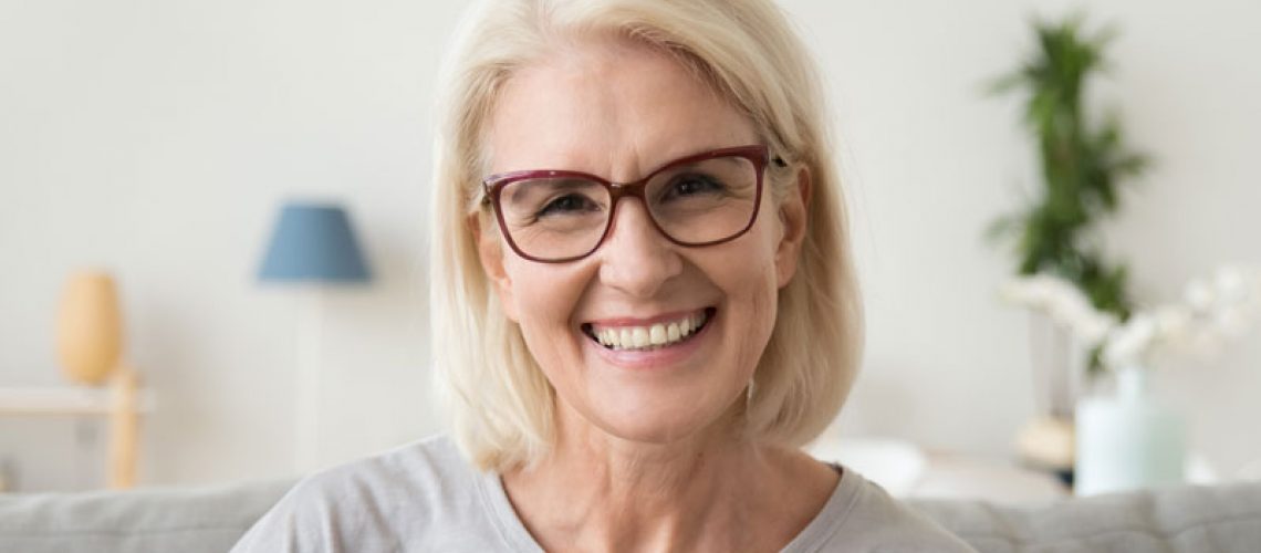 Dental Patient Smiling After Getting Dental Implants In Bronx, NY