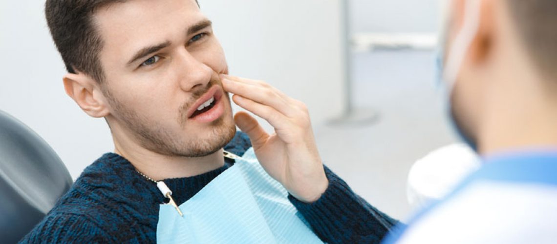 Dental Patient Suffering From Mouth Pain On A Dental Chair, In Bronx, NY